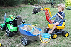 Baby boy playing with his excavator toy