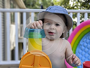 Baby boy playing in summer