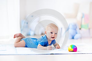 Baby boy playing with toy ball