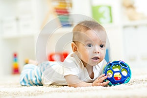 Baby boy playing with toy indoor