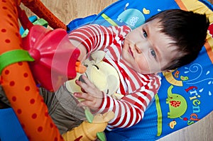 Baby boy playing with toys