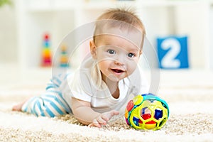 Baby boy playing with toys indoor
