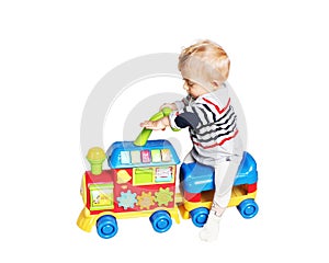 Baby boy playing with train toy