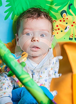 Baby boy on playmat photo