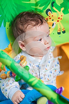 Baby boy on playmat