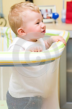 Baby boy in playpen.