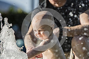 Baby Boy Plays in a Fountain in Mexico