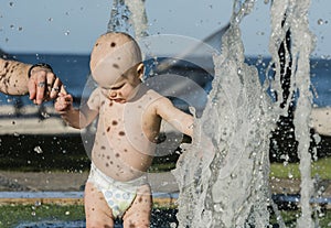 Baby Boy Plays in a Fountain While on Vacation in Mexico