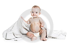 Baby boy portrait on white background with bath towel over his head