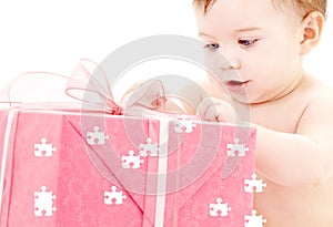 Baby boy with puzzle gift box