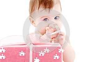 Baby boy with puzzle gift box