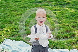 Baby boy with rabbit and eggs