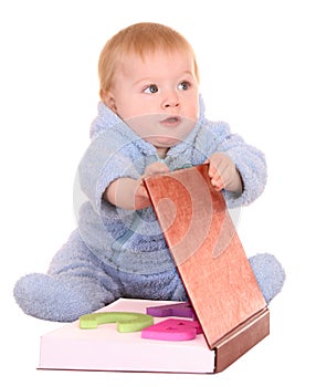 Baby boy read big red book.