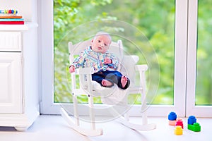 Baby boy on a rocking chair