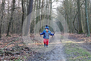 Baby boy running through the forest
