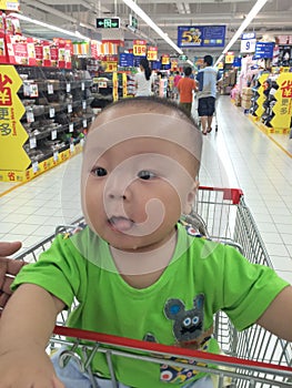 baby boy in shopping cart
