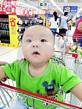 baby boy in shopping cart