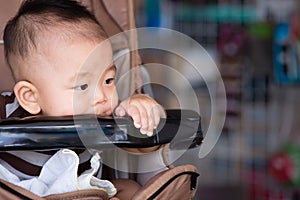 Baby boy sitting stroller