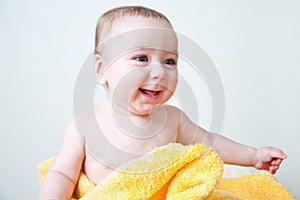 Baby Boy Sitting Wrapped in Yellow Towel