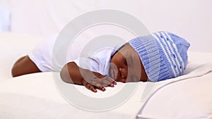 Baby boy sleeping in crib