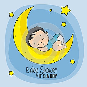 Baby boy sleeping on top of the moon