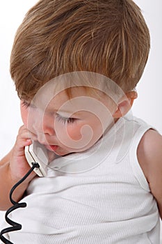 baby boy talking on the phone