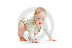 Baby boy toddler isolated trying to stand up photo