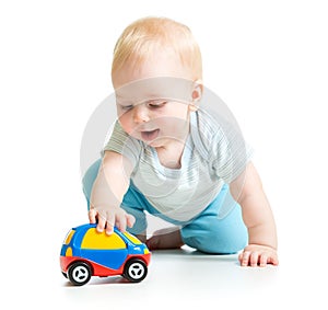 Baby boy toddler playing with toy car