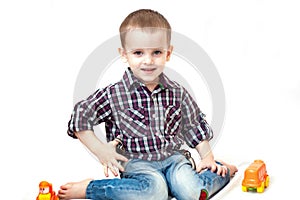 Baby boy toddler playing with toy car isolated