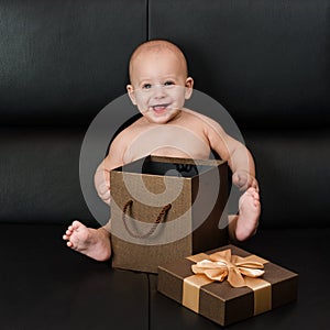 Baby boy unpacking surprise box