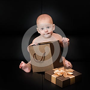 Baby boy unpacking surprise box