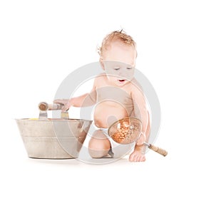Baby boy with wash-tub and scoop