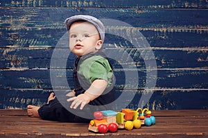 Baby boy on wooden backgroun