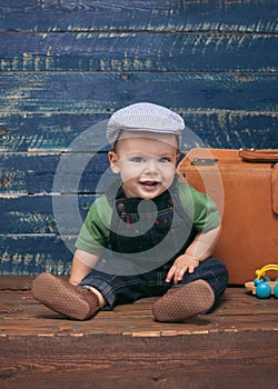 Baby boy on wooden background
