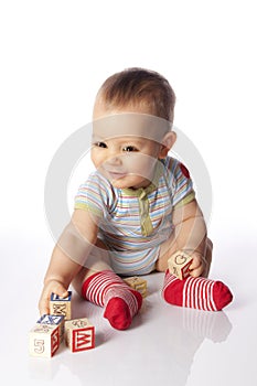 Baby boy with wooden blocks