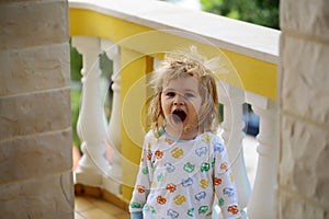 Baby boy yawns after sleeping