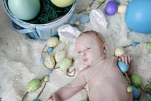 Baby with bunny ears on an Easter Set