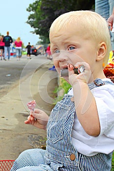 Baby with Candy at Parade