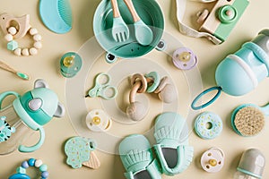 Baby care accessories and bootees. Newborn baby pacifier, teethers, nail scissors, hair brush, spoon and fork