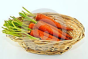 Baby carrots in wicker basket.