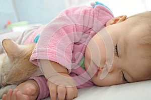 Baby and cat sleeping