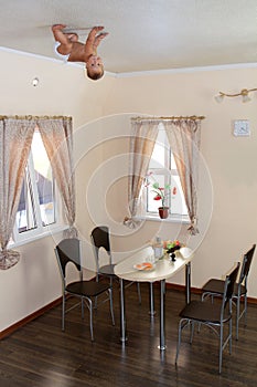 Baby on ceiling at home