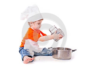Baby chef sifting flour isolated on white background