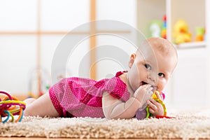 Baby chewing on teething toy