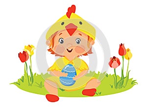 Baby in chick costume with decorative egg