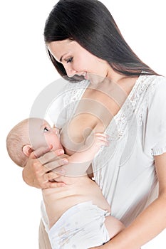 Baby child drinking breastmilk with happy mother isolated on white background