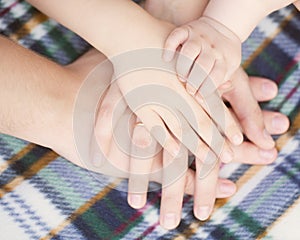 Baby, child, mother, father hands. Family concept