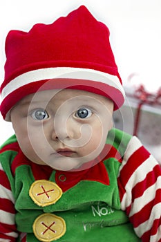 Baby at christmas with present