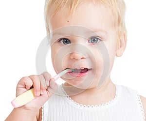 Baby cleaning teeth and smiling