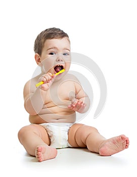 Baby cleaning teeth and smiling